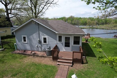 Escape to this peaceful lake home that is situated at the end of - photo 3