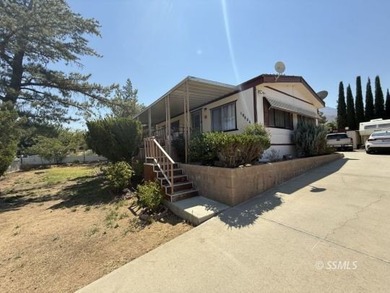 This inviting 1984 manufactured home, set on a permanent - photo 1