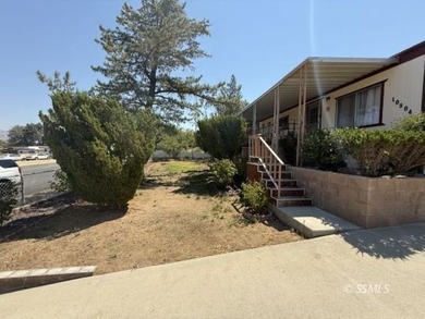 This inviting 1984 manufactured home, set on a permanent - photo 3