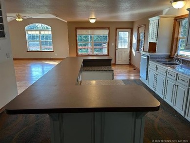 This home is placed in the center of a fenced and gated 5-acre