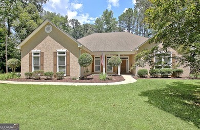 Welcome home to this spacious ranch situated on a private 1+