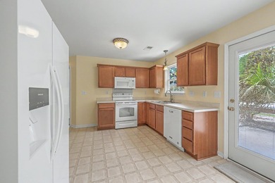 Nestled on a prime corner lot with serene pond views, this - photo 11