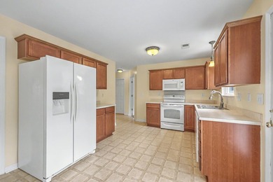 Nestled on a prime corner lot with serene pond views, this - photo 12
