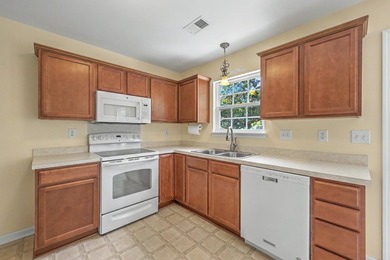 Nestled on a prime corner lot with serene pond views, this - photo 13