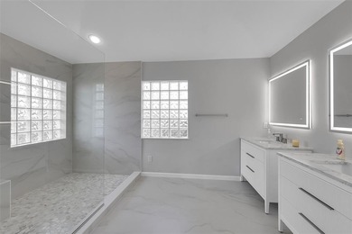 Beautifully remodeled pool home with stunning lake and golf