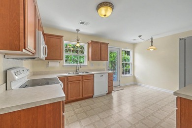 Nestled on a prime corner lot with serene pond views, this - photo 14