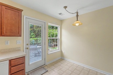 Nestled on a prime corner lot with serene pond views, this - photo 15