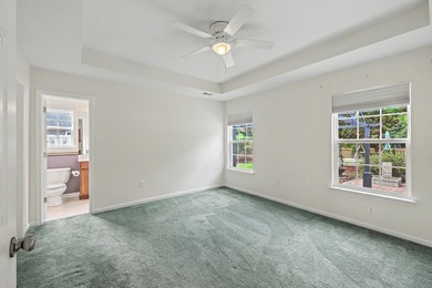 Nestled on a prime corner lot with serene pond views, this - photo 16