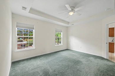 Nestled on a prime corner lot with serene pond views, this - photo 17