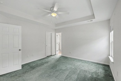 Nestled on a prime corner lot with serene pond views, this - photo 18
