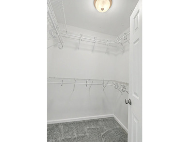 Nestled on a prime corner lot with serene pond views, this - photo 19