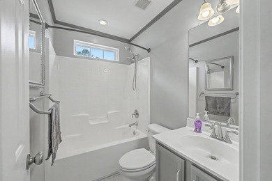 Nestled on a prime corner lot with serene pond views, this - photo 25