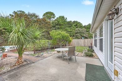 Nestled on a prime corner lot with serene pond views, this - photo 26