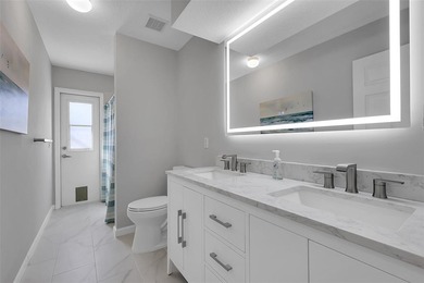 Beautifully remodeled pool home with stunning lake and golf