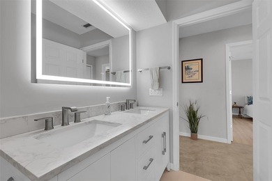 Beautifully remodeled pool home with stunning lake and golf