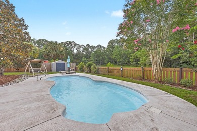 Nestled on a prime corner lot with serene pond views, this - photo 29