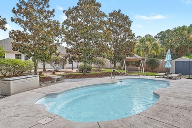 Nestled on a prime corner lot with serene pond views, this - photo 31