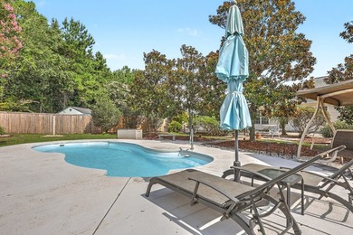 Nestled on a prime corner lot with serene pond views, this - photo 32