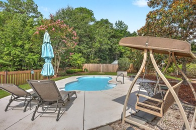 Nestled on a prime corner lot with serene pond views, this - photo 33