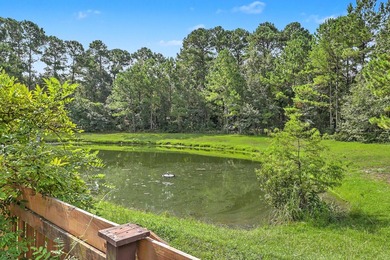 Nestled on a prime corner lot with serene pond views, this - photo 34