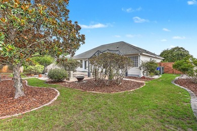 Nestled on a prime corner lot with serene pond views, this - photo 35