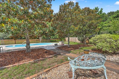 Nestled on a prime corner lot with serene pond views, this - photo 37