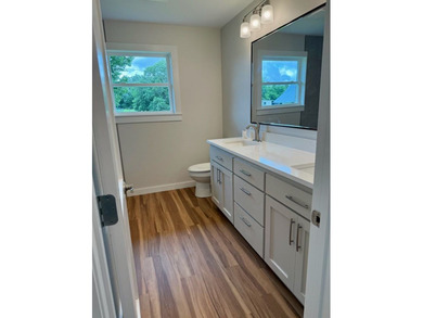 Completely rebuilt & renovated from the studs up, this - photo 12