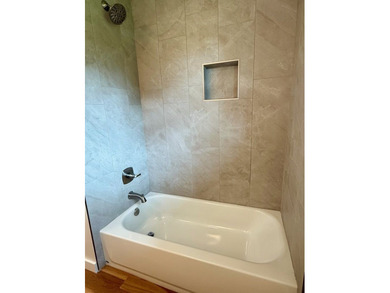 Completely rebuilt & renovated from the studs up, this - photo 13