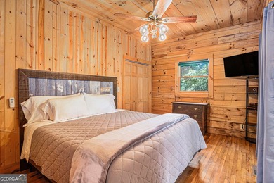 This beautiful log cabin home is located on the edge of the - photo 13