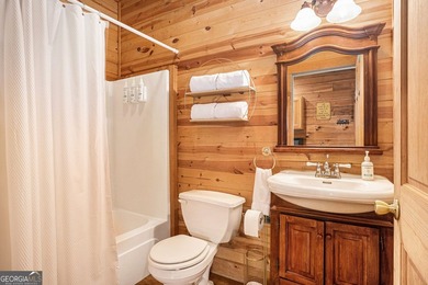 This beautiful log cabin home is located on the edge of the - photo 14