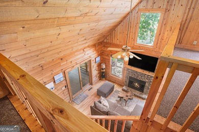 This beautiful log cabin home is located on the edge of the - photo 15