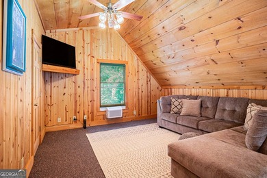This beautiful log cabin home is located on the edge of the - photo 16