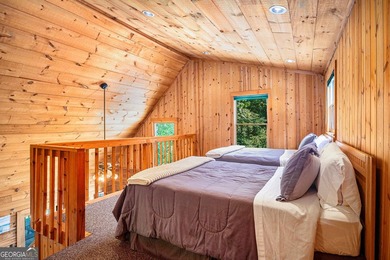 This beautiful log cabin home is located on the edge of the - photo 17