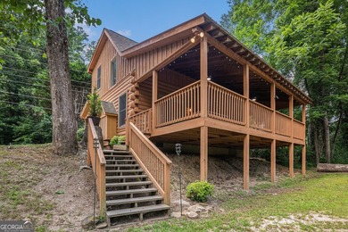 This beautiful log cabin home is located on the edge of the - photo 19