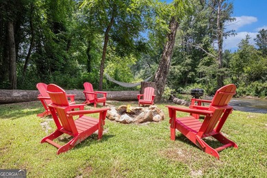This beautiful log cabin home is located on the edge of the - photo 20