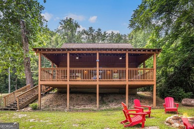 This beautiful log cabin home is located on the edge of the - photo 21