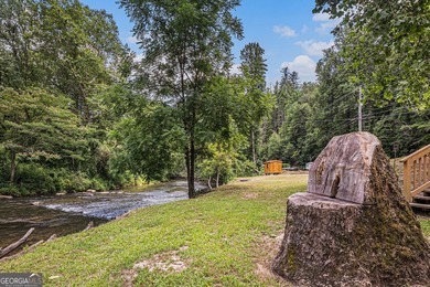 This beautiful log cabin home is located on the edge of the - photo 23