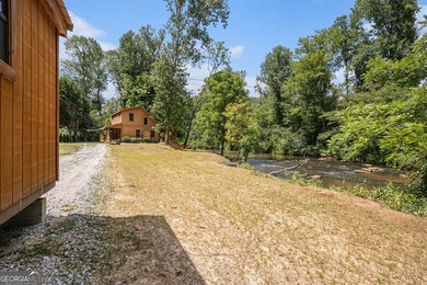This beautiful log cabin home is located on the edge of the - photo 25
