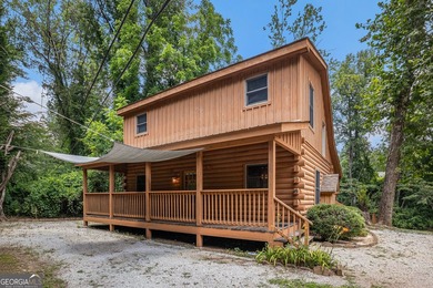 This beautiful log cabin home is located on the edge of the - photo 26