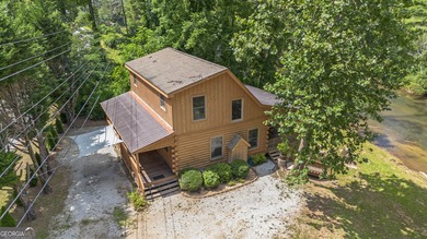 This beautiful log cabin home is located on the edge of the - photo 27