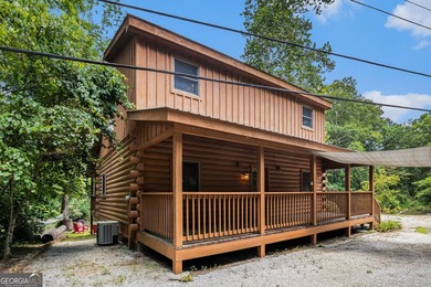 This beautiful log cabin home is located on the edge of the - photo 30