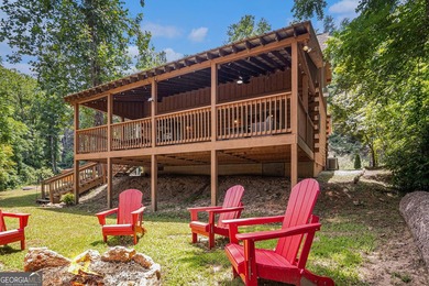 This beautiful log cabin home is located on the edge of the - photo 31