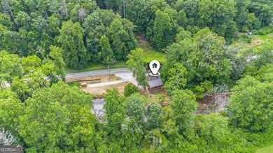 This beautiful log cabin home is located on the edge of the - photo 33