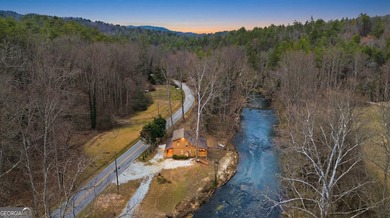 This beautiful log cabin home is located on the edge of the - photo 34