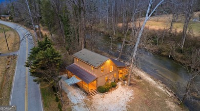This beautiful log cabin home is located on the edge of the - photo 36