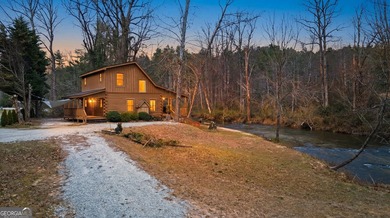 This beautiful log cabin home is located on the edge of the - photo 37