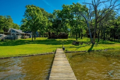 Introducing this charming 1,341 square-foot lakefront retreat on - photo 2