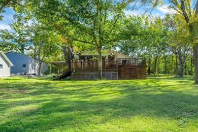 Introducing this charming 1,341 square-foot lakefront retreat on - photo 3