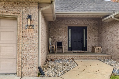 This gorgeous 3 bed, 2 bath, all-brick home with a three-car