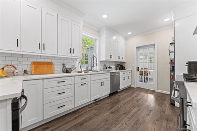 Welcome to this fully renovated gem located in the highly - photo 4